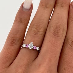 18 White Gold Diamond Ring, Set With Pink Sapphires