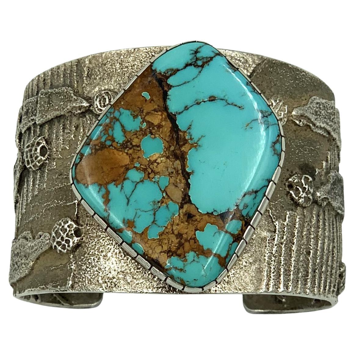 Sterling Silver tufa cast cuff with turquoise stone by Darryl and Rebecca Begay For Sale