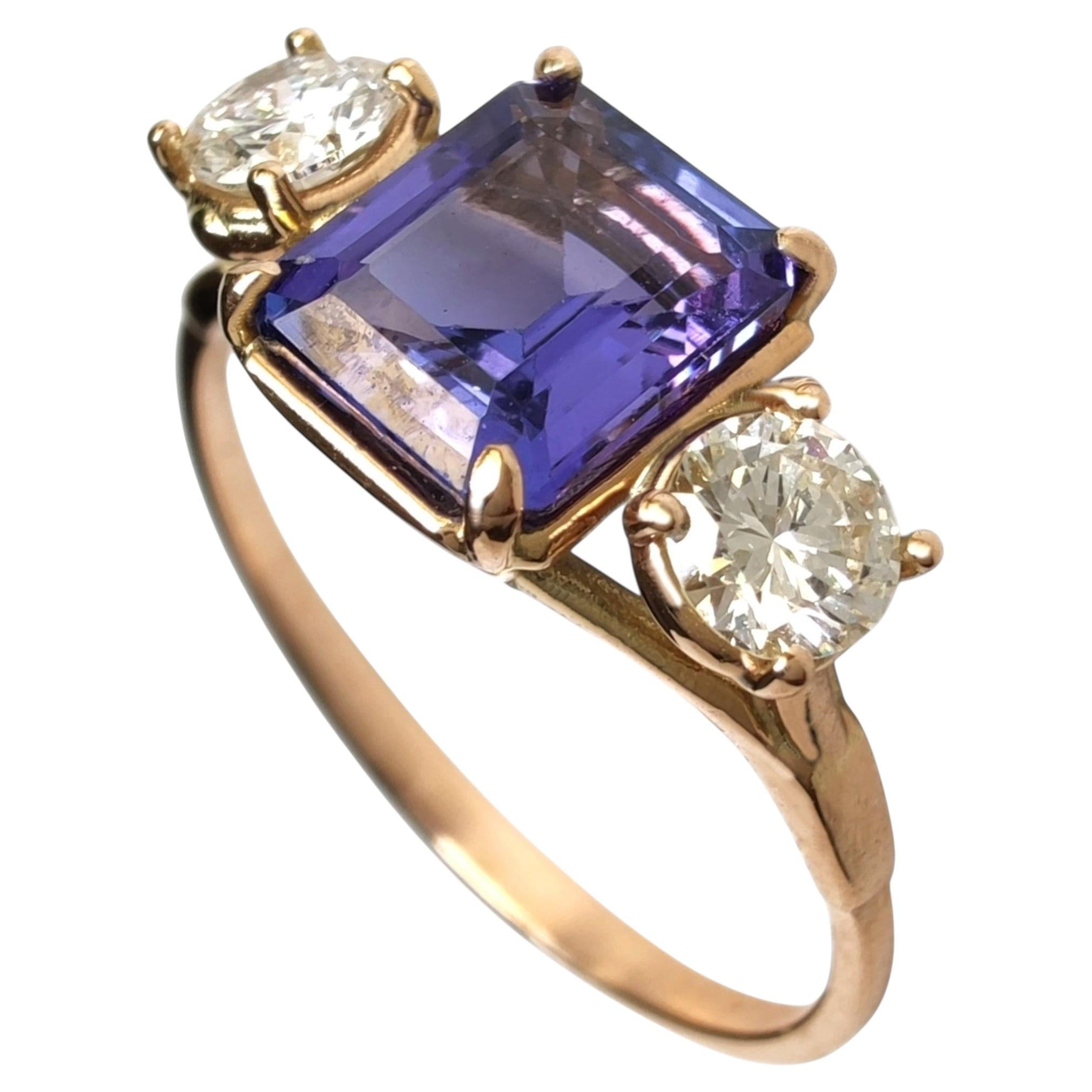 1.36 Carat Tanzanite and 0.82 ctw VVS Diamond 14k Gold Three Stone Ring