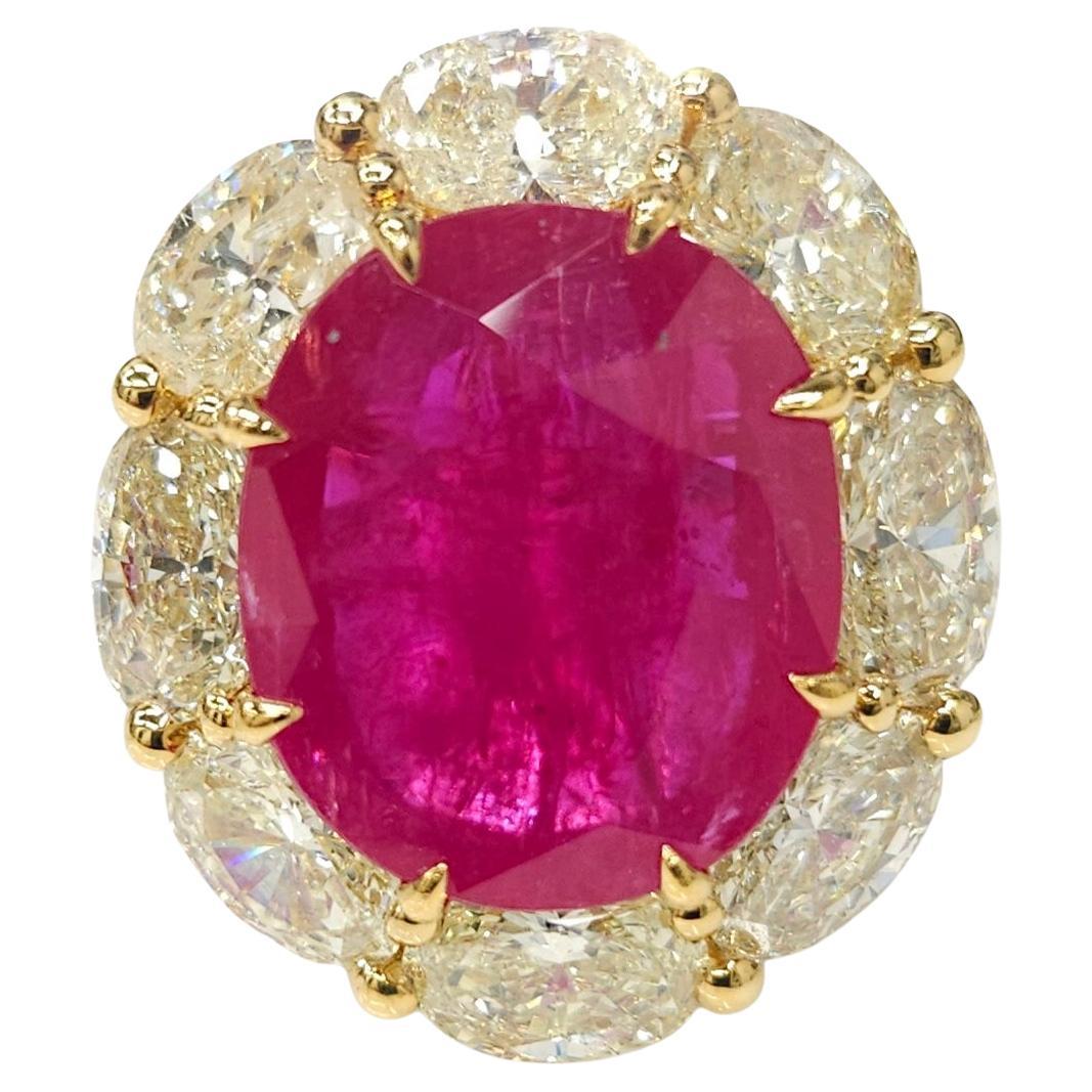 Indulge in the utmost elegance with this breathtaking IGI Certified 6.53 Carat ruby ring, a true testament to remarkable craftsmanship and exceptional gemstones. Featuring an intense pink-red color and an elegant oval shape, this rare and exquisite