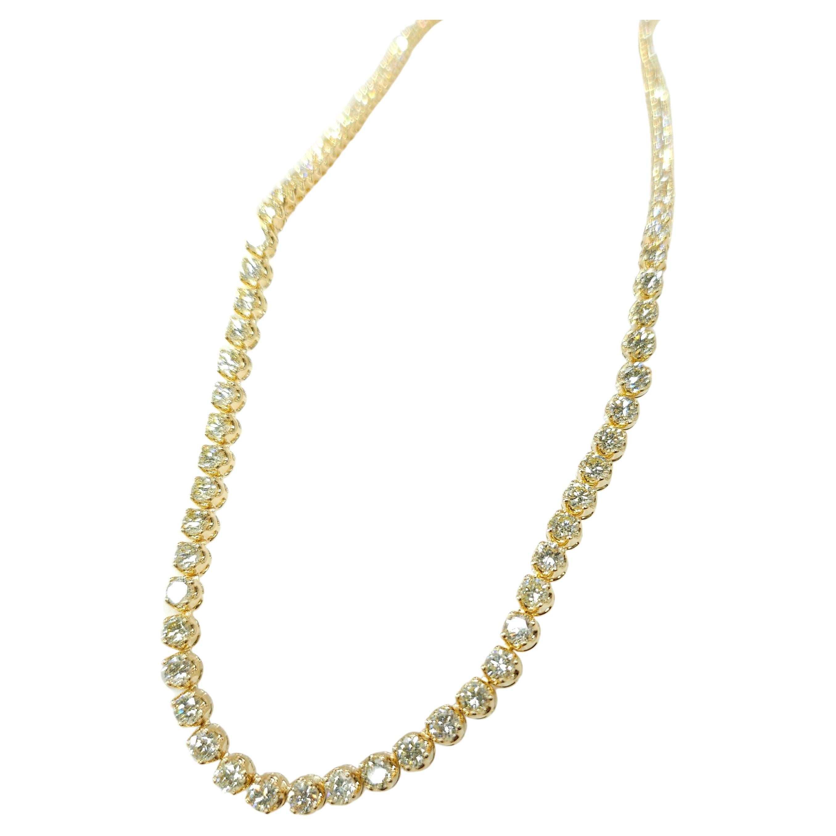Adorn your wrist with the timeless elegance and shimmering beauty of this exquisite 11.95 Carat Total Round Diamond Tennis Necklace in 18K Yellow Gold. Crafted to perfection, this necklace is a true statement piece that exudes luxury and