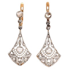 Art Deco drop gold earrings with diamonds, circa 1925.