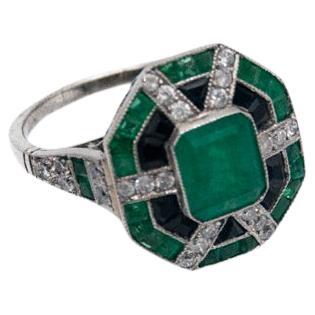 Art Deco platinum ring with emeralds, onyxes and diamonds, 1940s.