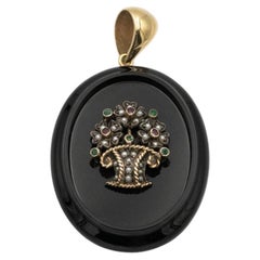 Old pendant locket - sentimental medallion set with rubies, emeralds, and pearls