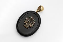 Old pendant locket - sentimental medallion set with rubies, emeralds, and pearls