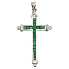 18k white gold cross pendant with emeralds and diamonds
