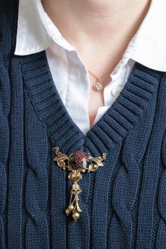 Gold-plated antique brooch-pendant with garnets and pearls