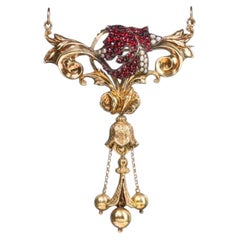 Gold-plated antique brooch-pendant with garnets and pearls