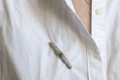Oblong old platinum and yellow gold brooch with diamonds and tourmaline.