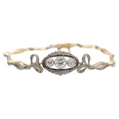 Antique gold and platinum bracelet with diamonds and synthetic sapphires.