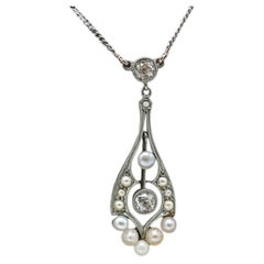Necklace in 14k yellow and white gold with pearls and diamonds.