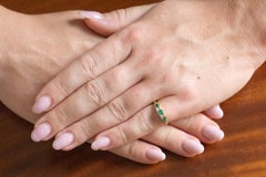 Antique 18-karat gold ring with emeralds and diamonds, early 20th century.