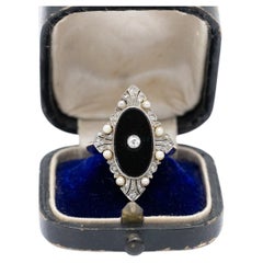 Unique Art Deco ring with onyx, diamonds, and pearls
