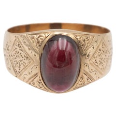 14k Gold signet ring with a cabochon-cut garnet, Austro-Hungarian 1872–1922.
