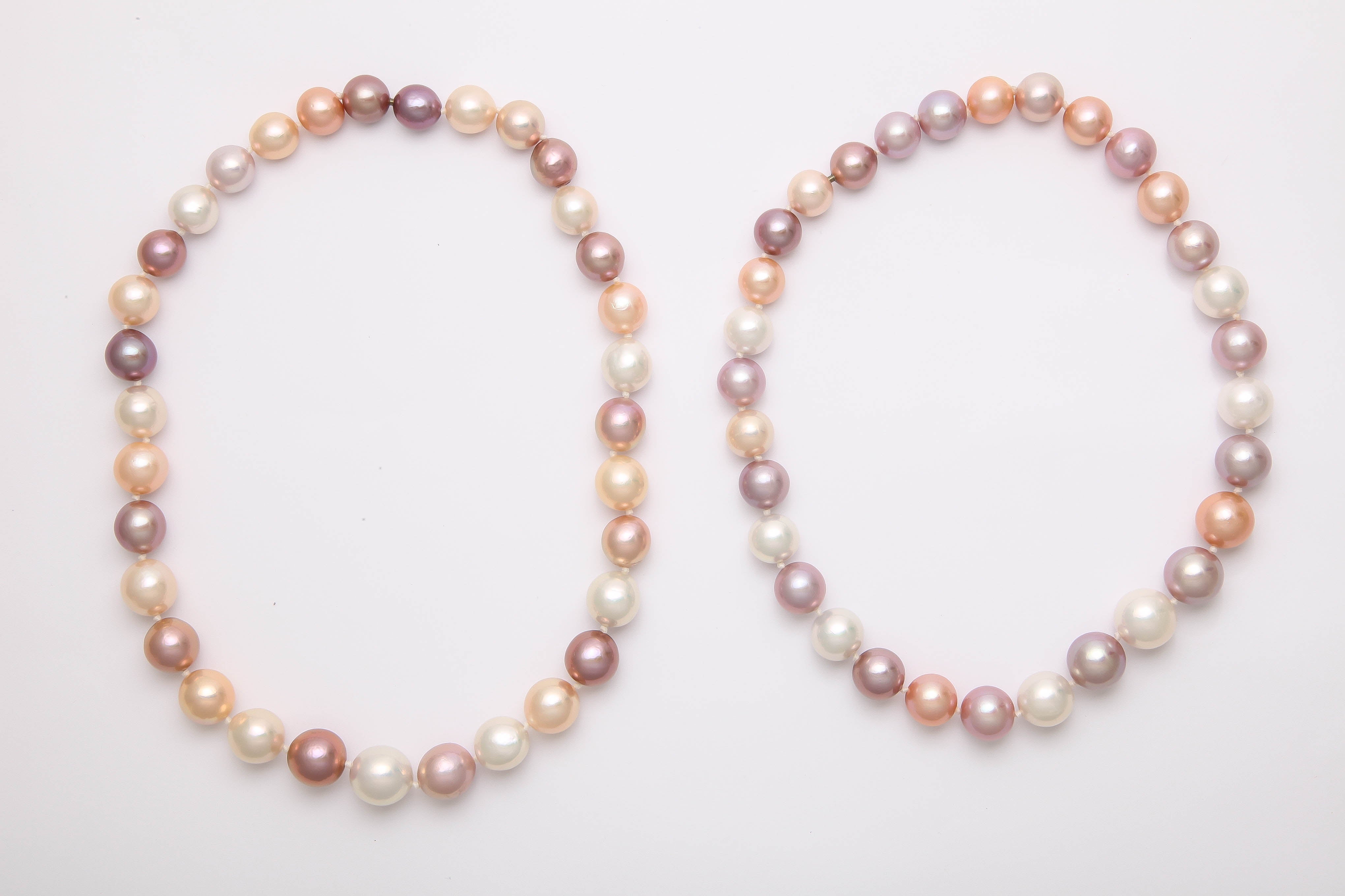 12-15mm high lustre pearls. They nest separately and join together with mystery screws to be worn as a single short necklaces, 2 short necklaces or as 1 long necklace.
