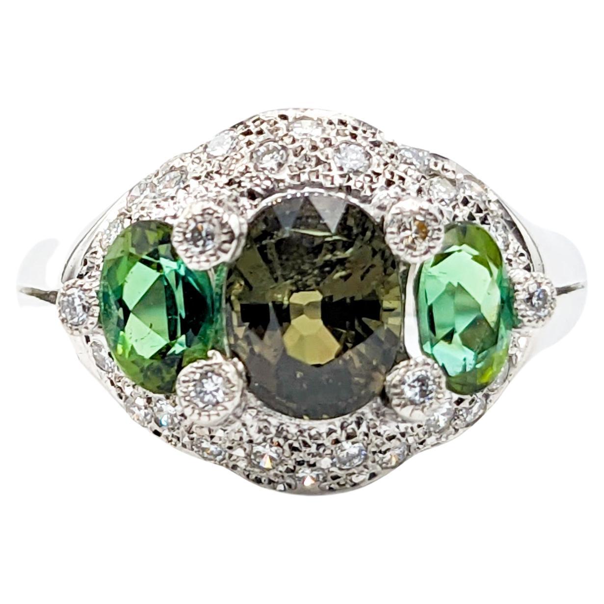Color Transforming Platinum Alexandrite, Tourmaline & Diamond Ring

Indulge in the sheer elegance of this beautiful ring, crafted from 900pt platinum and .34ctw diamonds. The round diamonds sparkle brilliantly with their H color and SI1 clarity. The
