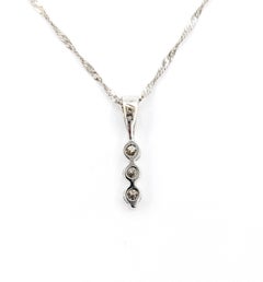 Délicat pendentif barrette de diamants en or blanc 14k
