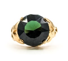 Anillo solitario de turmalina verde con filigrana en oro amarillo de 14k