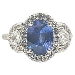 Oval Sapphire and Diamond Cluster Halo Ring in 18k White Gold