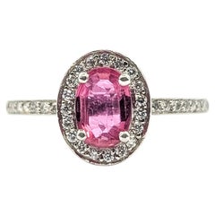 Oval Pink Sapphire and Diamond Halo Ring in Platinum