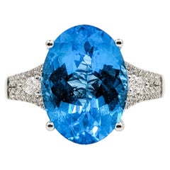 Anillo de oro blanco de 14k con topacio azul y diamantes, de banda dividida