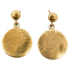 Pendientes colgantes con discos redondos en oro amarillo de 14k