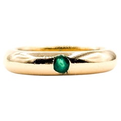 Bague solitaire en or jaune 18k avec émeraude