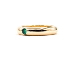 Bague solitaire en or jaune 18k avec émeraude
