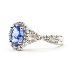 Tanzanite and Diamond Halo Twist Band Ring in 10K White Gold