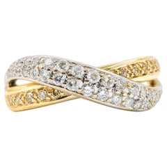 Anello crossover con diamanti bianchi e gialli in oro giallo 14 carati