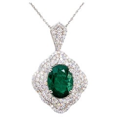 Collana con motivo floreale "halo" con smeraldi e diamanti in platino - GIA n. 5231644838
