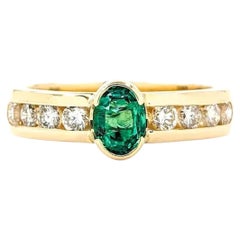 Anello con smeraldo e diamante in oro giallo 14k