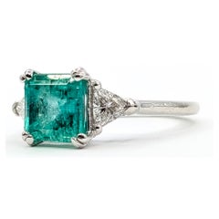 1.65ct Emerald and Trillion Diamond Three-Stone Platinum Ring