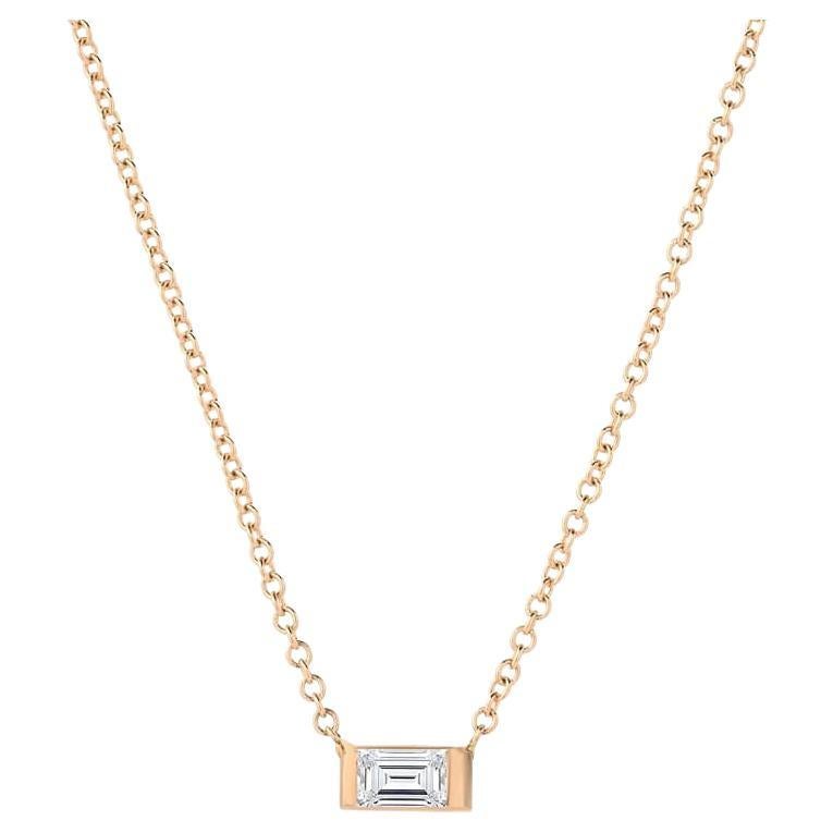 An emerald-shaped center diamond oriented horizontally in 14k gold.

Gold : 14K Gold
Color : Yellow, Rose or White Gold
Diamond Total Carats : 0.20ttcw
Necklace Length : 16 Inches 
Diamond Clarity : VS
Diamond Color : F-G
Chain Type : Cable
Clasp :