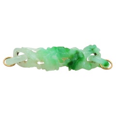 Pendentif figuratif en jade vert sculpté
