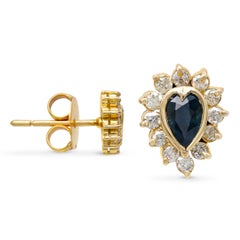 Vintage-Ohrstecker aus 12-karätigem Gelbgold mit Saphir und Diamanten im Halo-Design