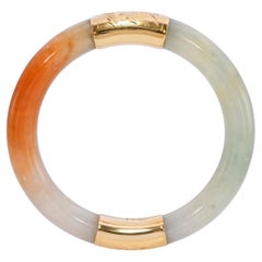 Brazalete vintage de oro amarillo de 14k con jadeíta verde y naranja de grado A según la GIA