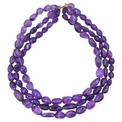 Dreisträngige Perlenkette aus 14-karätigem Gold mit Amethysten