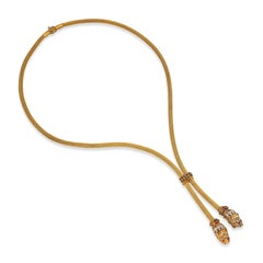 Collar lariat vintage de Ilias Lalaounis con cabeza de león, en oro amarillo de 18k