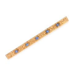 Broche antique en forme de barre, en or jaune 14 carats et saphir, gravée
