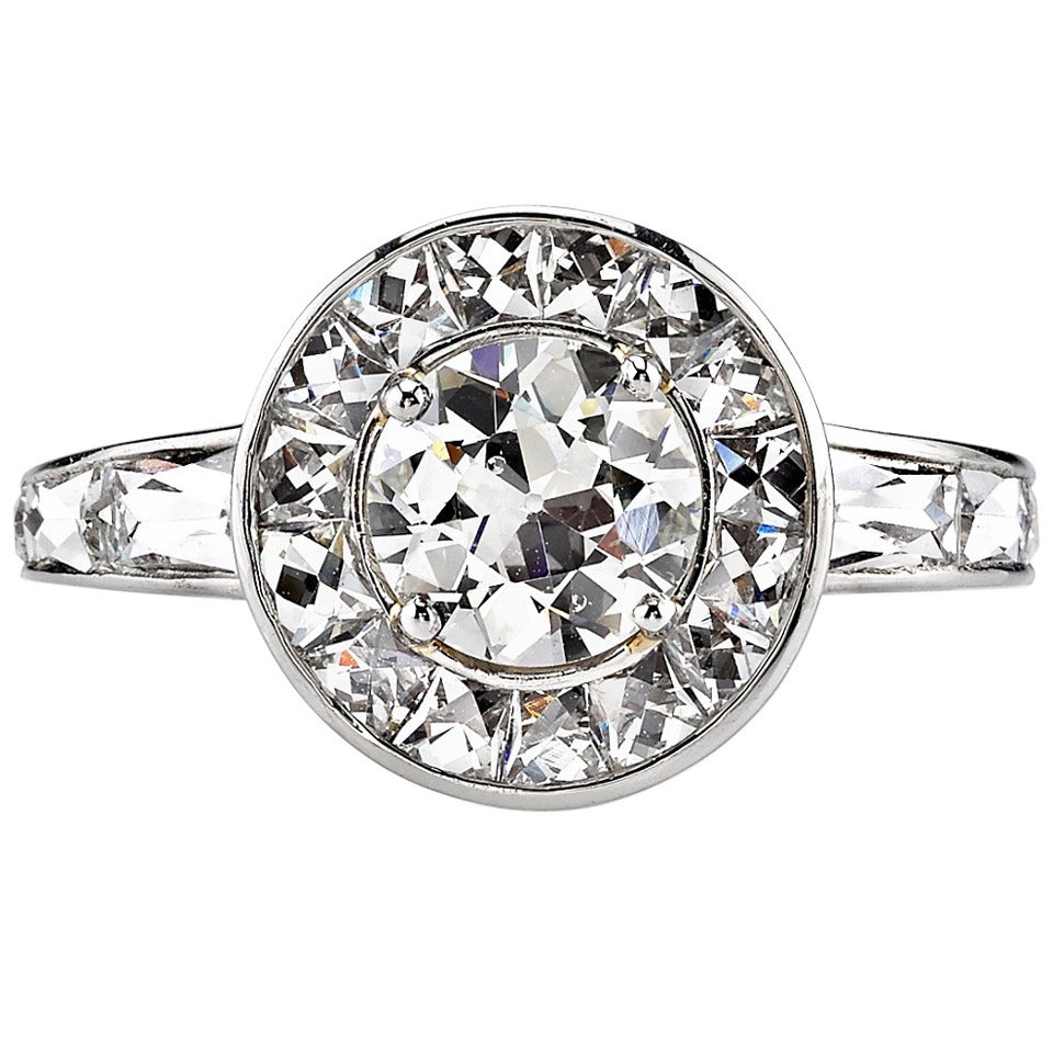 Round Diamond Surrounded by French Cut Diamonds Engagement Ring