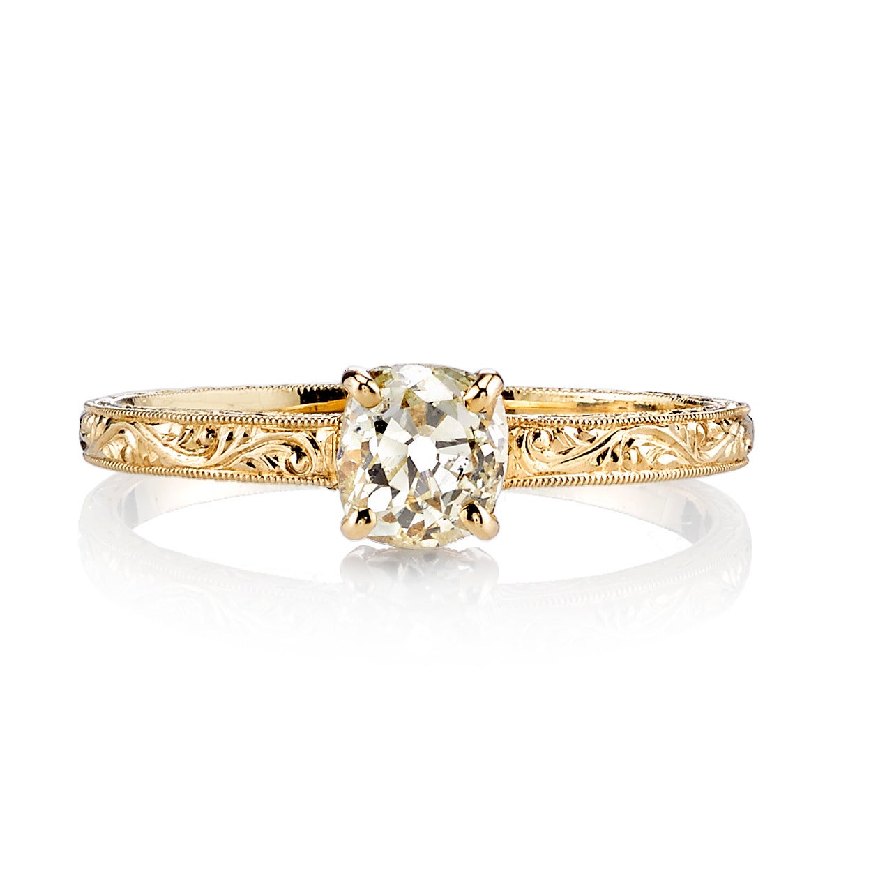 0.60ct Fancy Yellow/VS vintage Cushion cut diamond set in a handcrafted 18K yellow gold mounting. A classic Edwardian design that features hand engraving.