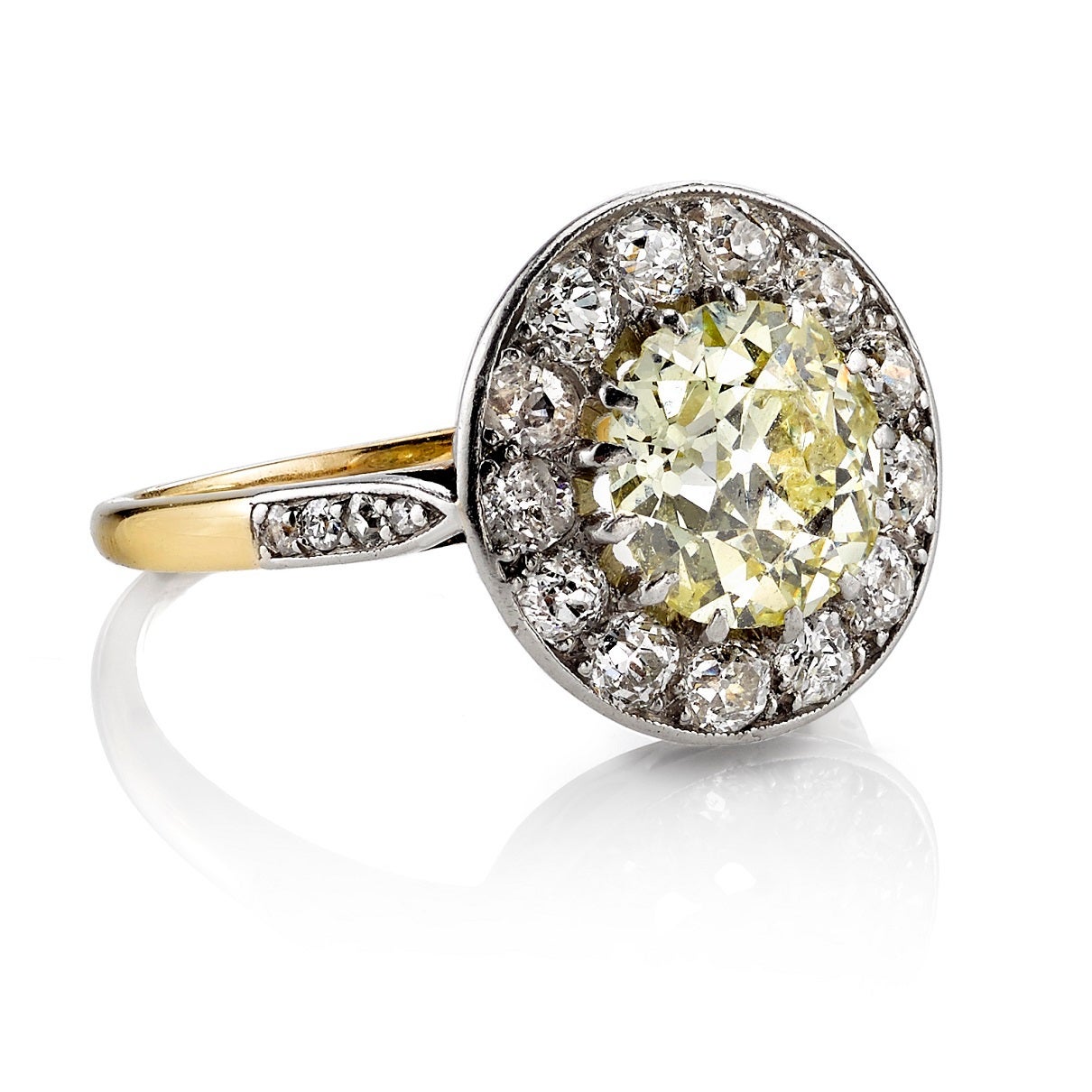 2.25ct Fancy Yellow/ SI2 old European cut diamond set in an 18K yellow gold and platinum mounting. Circa 1930.