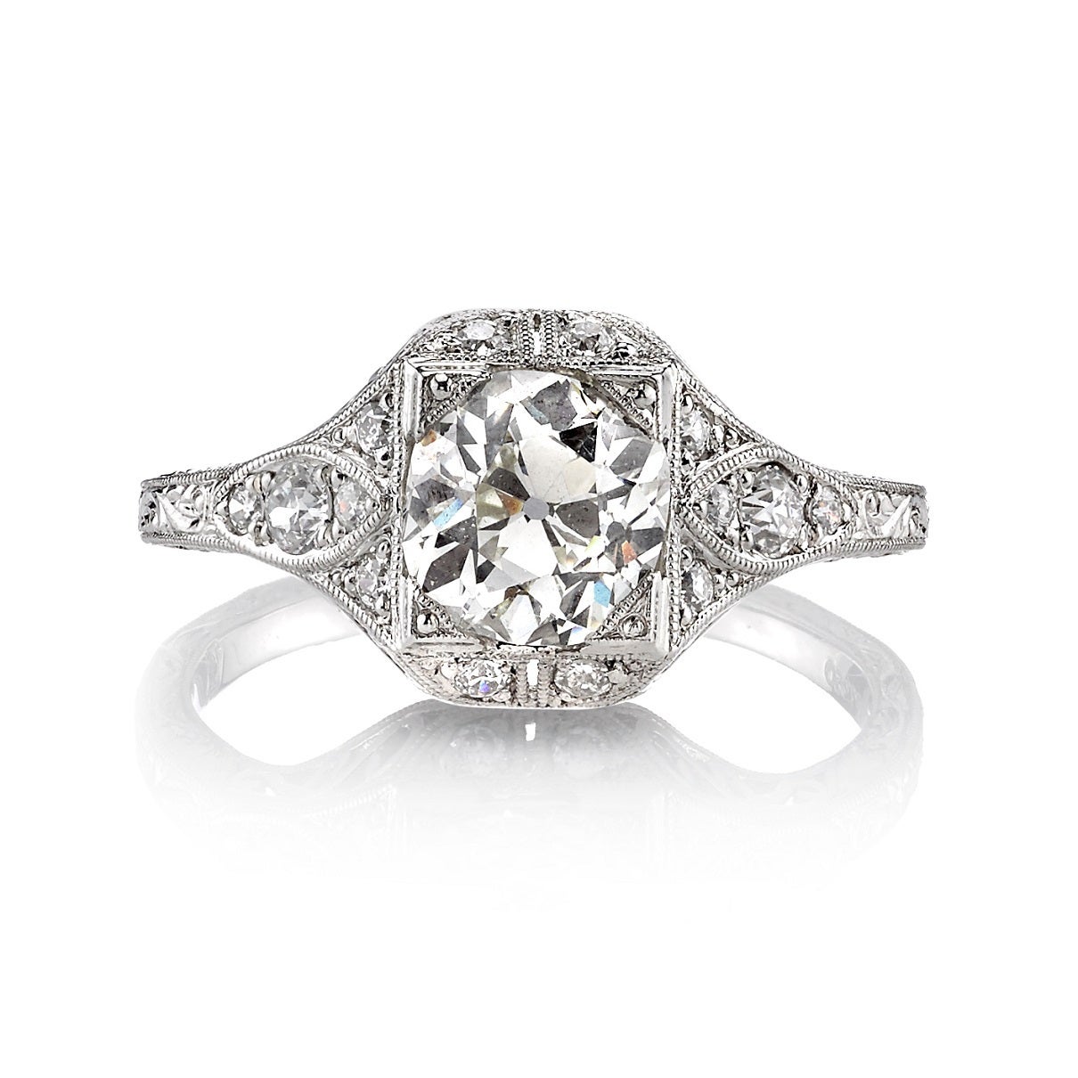 1.30ct L/VS vintage Cushion cut diamond set in a handcrafted platinum mounting. A classic Edwardian design that features hand engraving and filigree.