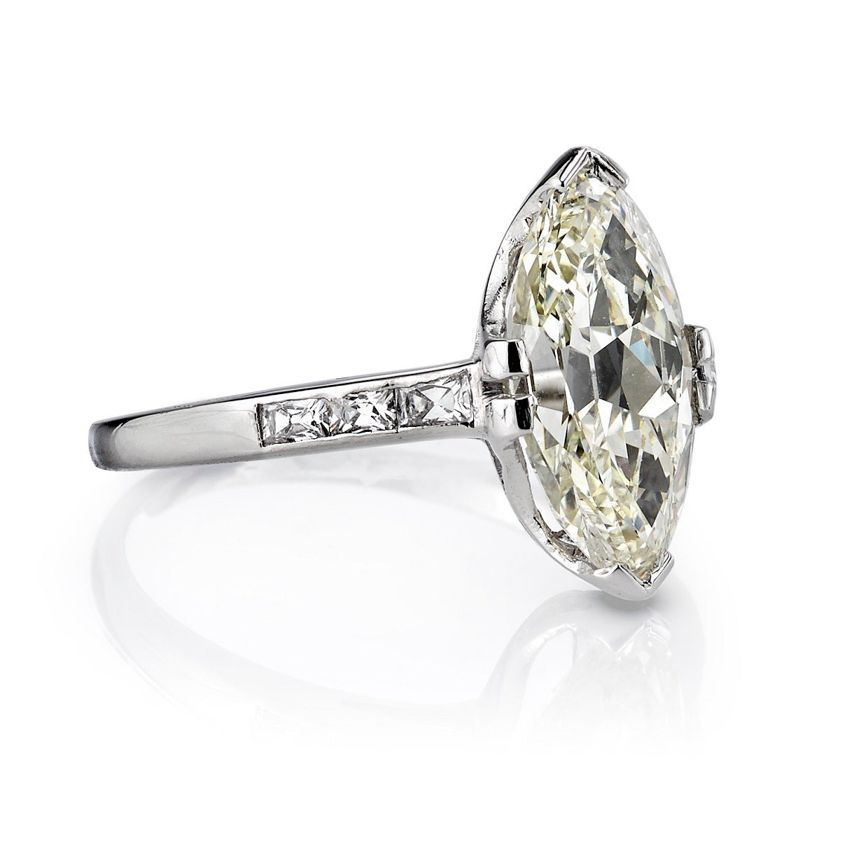 2.77ct OP/VS Moval cut diamond set in a platinum mounting. Circa 1930. A classic solitaire design with accent diamonds along the band.