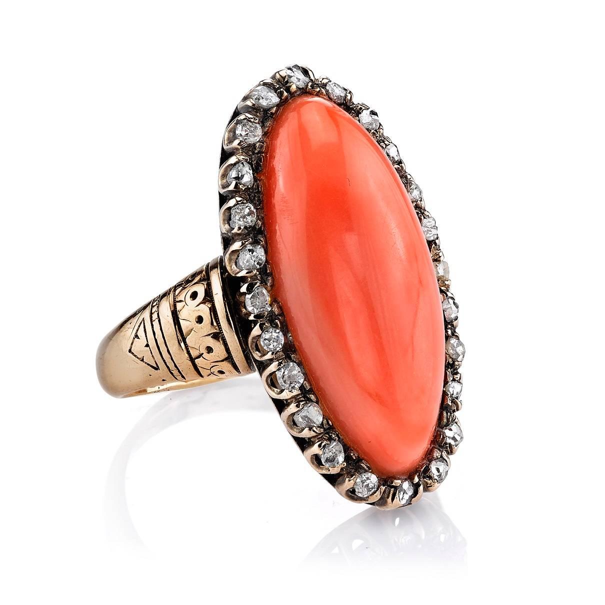 Coral with 0.25ctw Rose cut diamond surround set in a vintage 10k yellow gold mounting. Circa 1890.