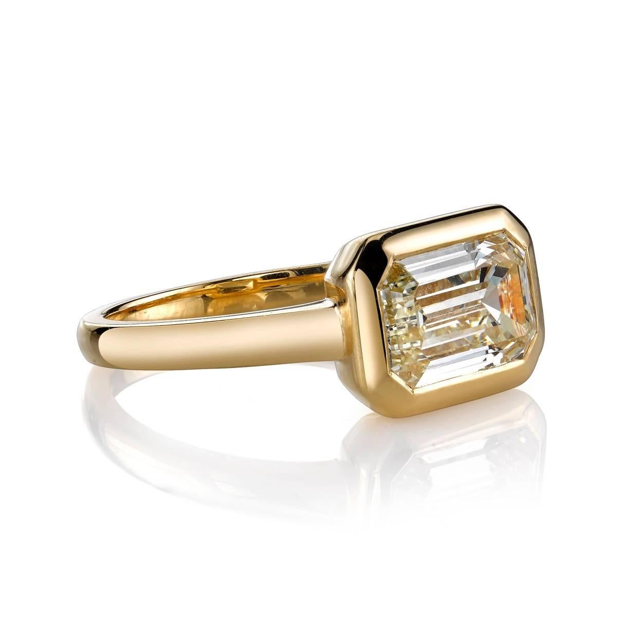 2.03ct L/VS2 EGL certified Emerald cut diamond set in a handcrafted 18k yellow gold setting. Bold yet classic, this beauty is a unique take on a solitaire design.