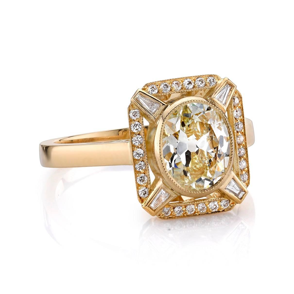 1.31ctw L/VS1 EGL certified antique oval cut diamond with 0.16ctw mixed cut diamonds set in a handcrafted 18K yellow gold mounting.  


