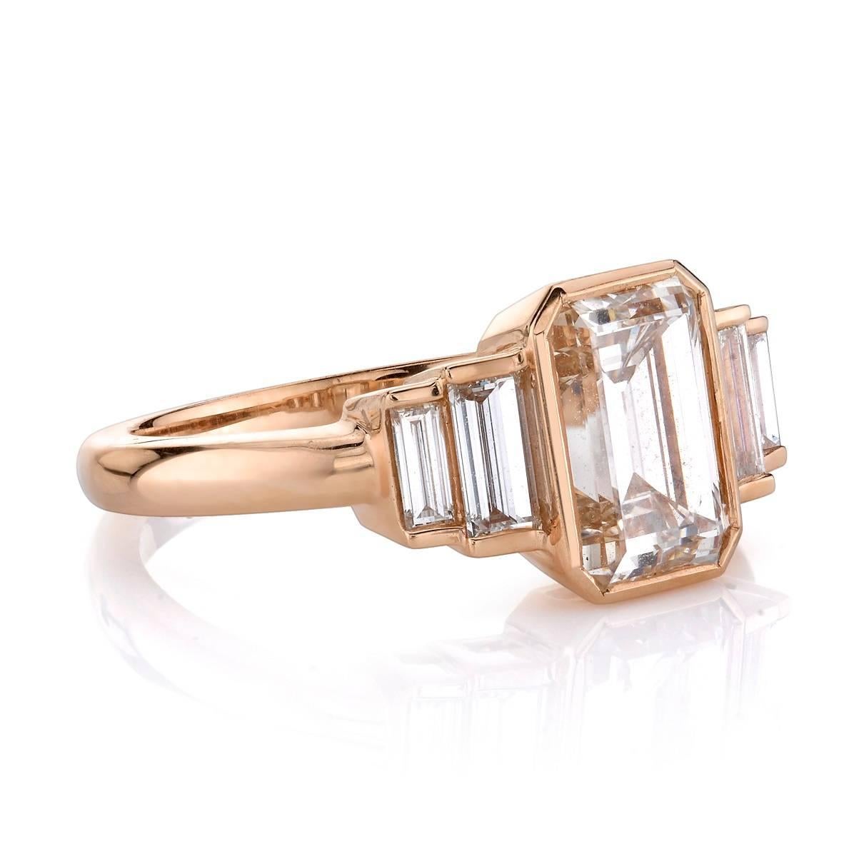 1.76ct K/VS2 Emerald cut diamond GIA certified and set in a handcrafted 18k rose gold mounting.  A classic and sleek design featuring bezel set diamonds and baguette accents.