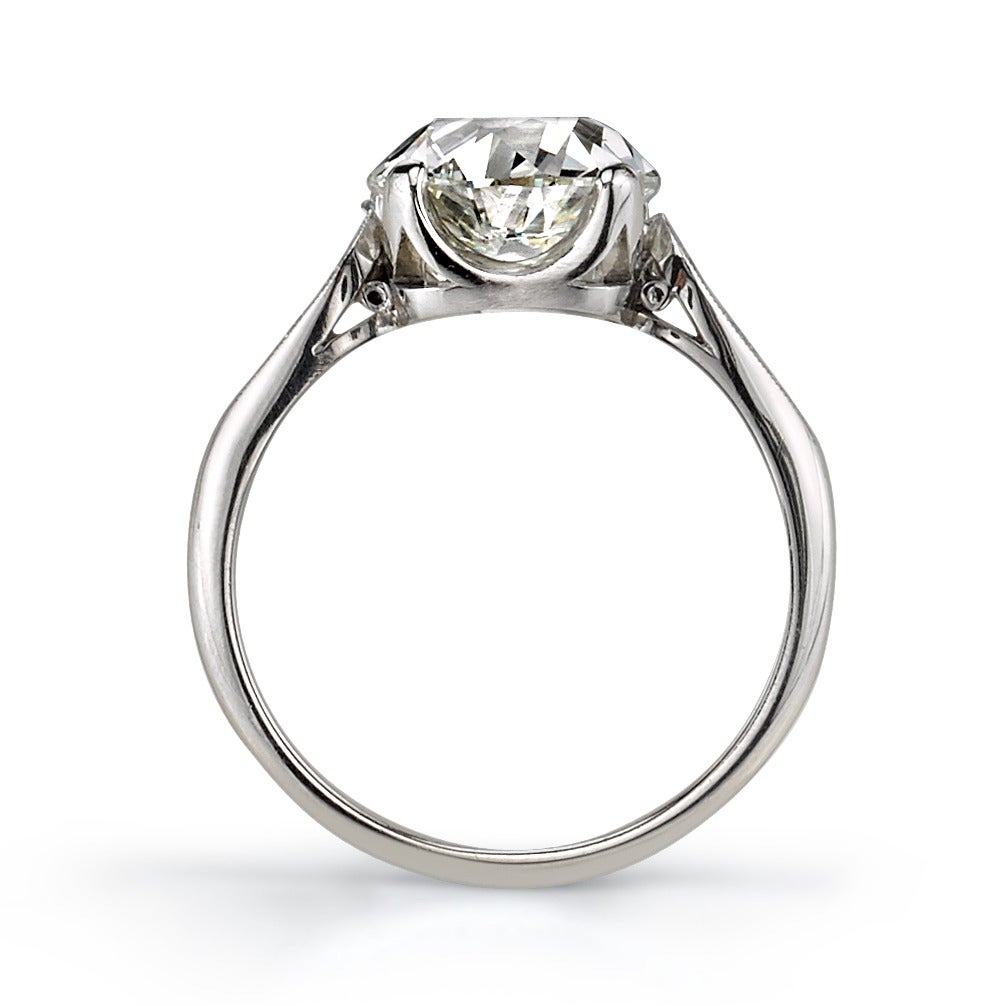 3.40ct K/VS1 GIA certified vintage Cushion cut diamond set in a handcrafted platinum mounting. A classic design featuring a prong set diamond and a tapering band.